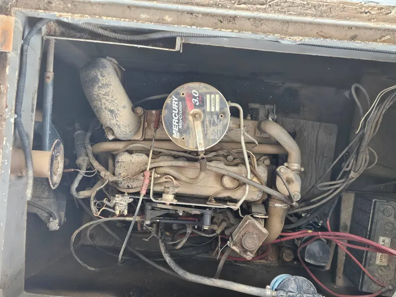 Slide: The Image of Engine compartment of a 1990 Skipperliner houseboat with a Mercury MerCruiser 3.0 engine. - 11
