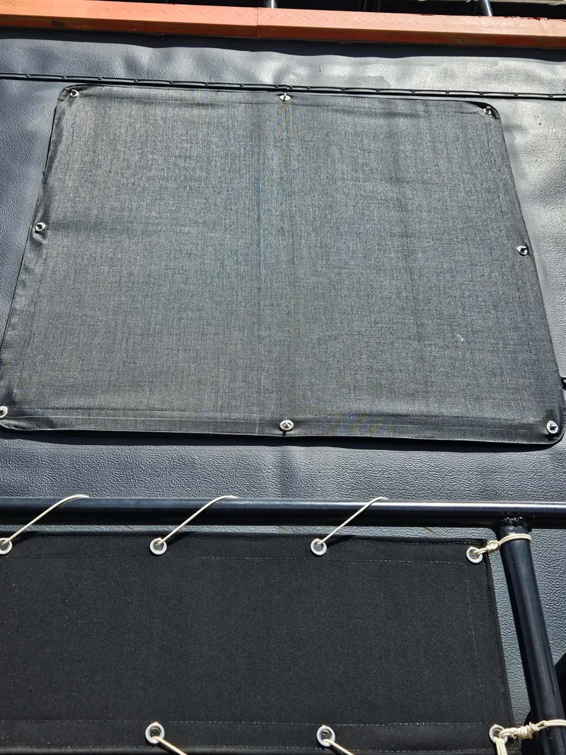 Slide: The Image of Close-up of a 1990 Skipperliner houseboat's canvas cover and railing. - 18