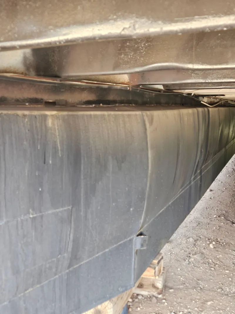 Slide: The Image of Close-up of the underside of a 1990 Skipperliner houseboat. - 3