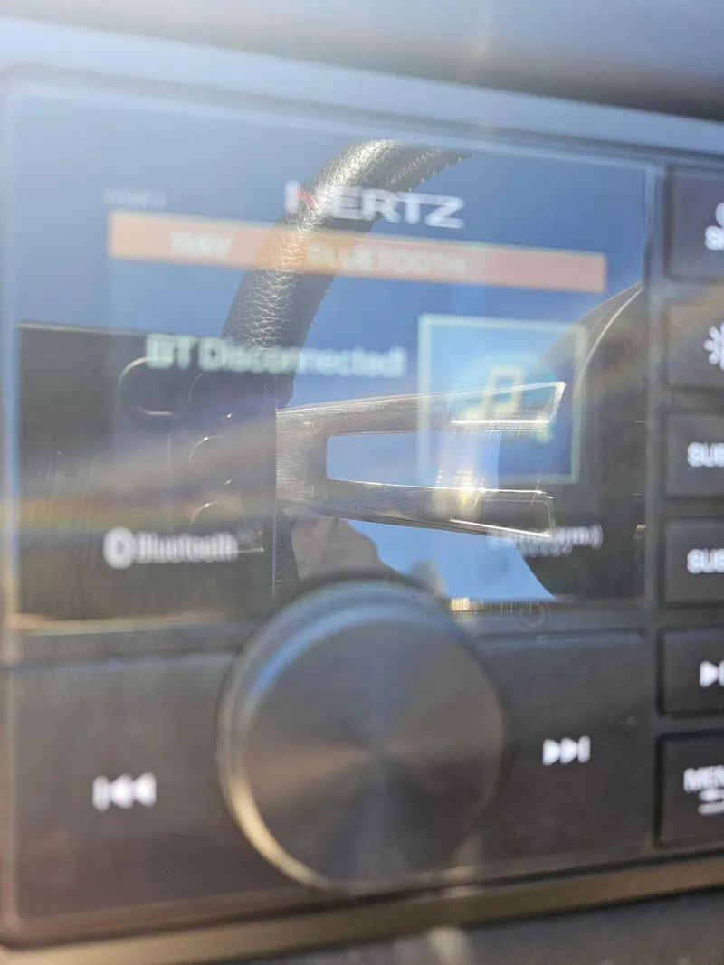 Slide: The Image of Close-up of a 2019 Barletta L21Q Pontoon stereo display showing Bluetooth disconnected. - 16