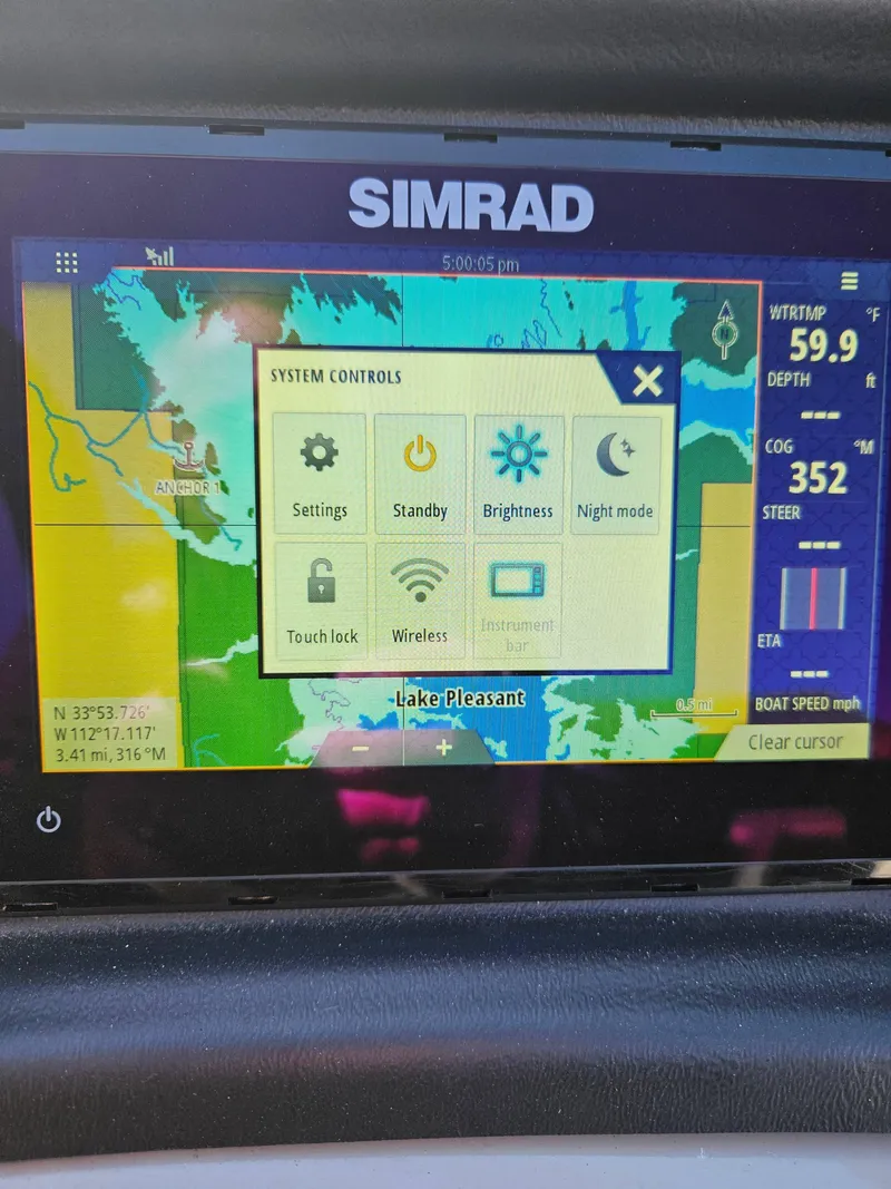Slide: The Image of Simrad navigation display on 2019 Barletta L21Q Pontoon, showing system controls and Lake Pleasant map. - 17