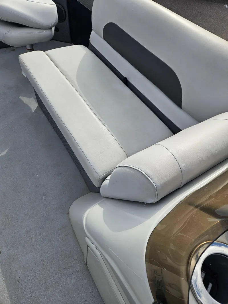Slide: The Image of 2019 Barletta L21Q Pontoon boat interior with gray seating and cup holder. - 5