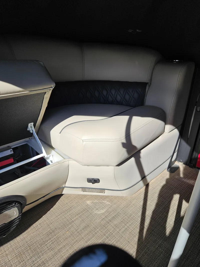 Slide: The Image of 2019 Barletta L21Q Pontoon interior seating with storage compartment. - 8