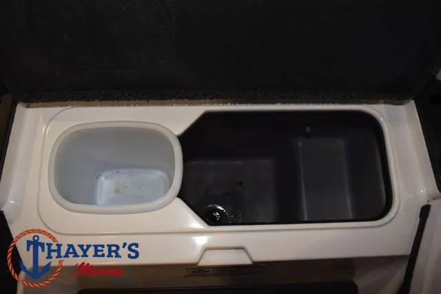 Slide: The Image of 2019 Nitro Z18 boat storage compartment with Thayer's Marine logo. - 14