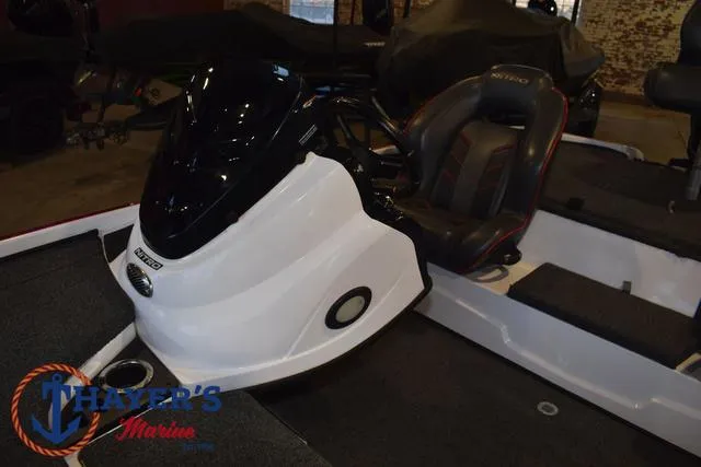 Slide: The Image of 2019 Nitro Z18 boat interior with steering console and seating at Thayer's Marine. - 19