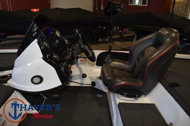 Slide: The Image of 2019 Nitro Z18 boat interior with steering console and seating at Thayer's Marine showroom. - 20