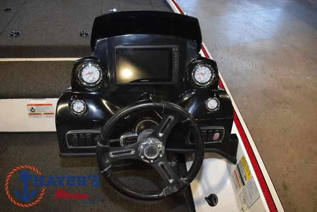 Slide: The Image of Dashboard of a 2019 Nitro Z18 boat with steering wheel and gauges. - 22