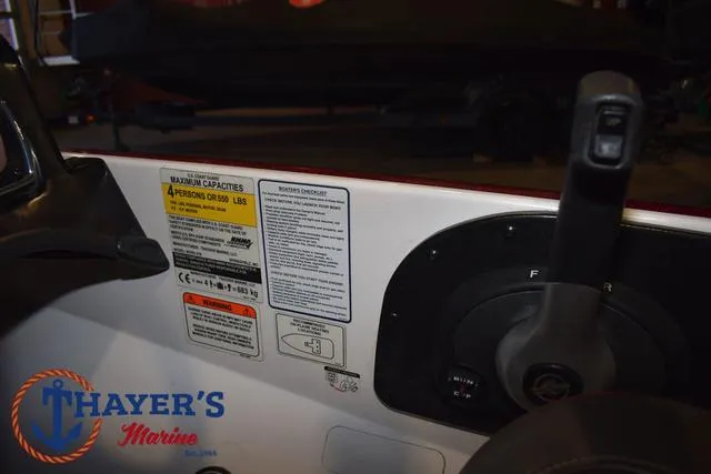 Slide: The Image of Control panel of a 2019 Nitro Z18 boat with capacity and safety labels. - 24