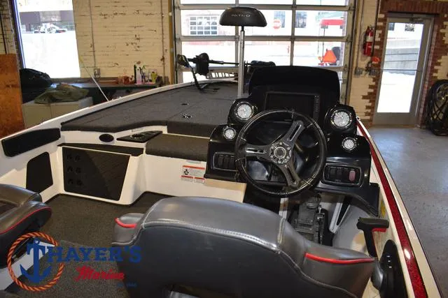Slide: The Image of Interior of a 2019 Nitro Z18 boat with steering wheel and dashboard controls. - 31