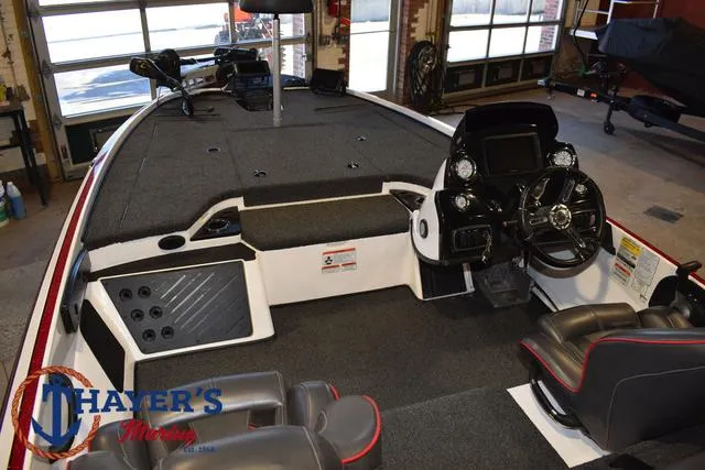 Slide: The Image of 2019 Nitro Z18 boat interior with steering wheel and seating in showroom. - 33