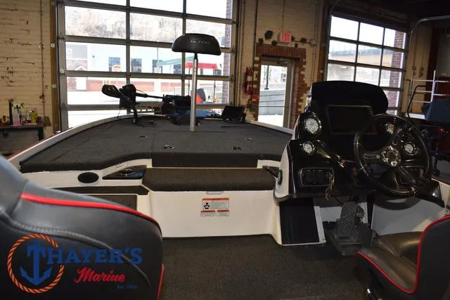 Slide: The Image of 2019 Nitro Z18 boat interior with steering console and seating at Thayer's Marine showroom. - 34