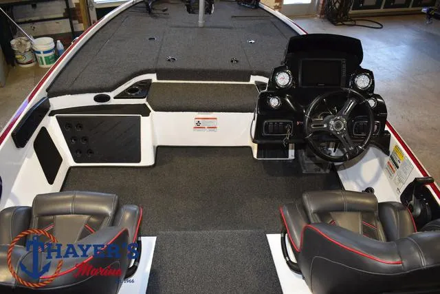 Slide: The Image of Interior of a 2019 Nitro Z18 boat with steering console and seating. - 35