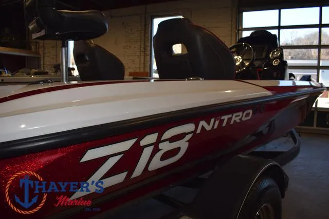 Slide: The Image of 2019 Nitro Z18 boat in showroom, featuring sleek design and comfortable seating. - 37