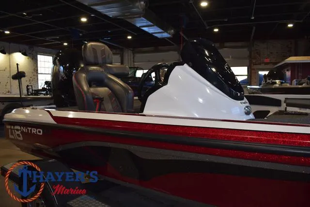 Slide: The Image of 2019 Nitro Z18 boat in showroom, featuring sleek design and comfortable seating. - 38