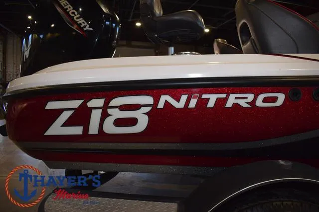 Slide: The Image of 2019 Nitro Z18 boat with Mercury engine, displayed indoors at Thayer's Marine. - 4