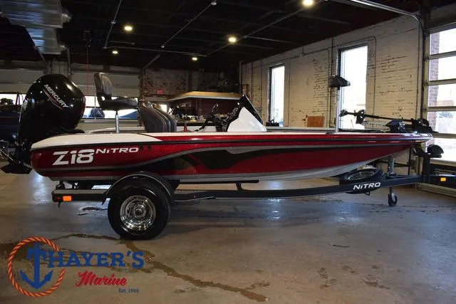 Slide: The Image of 2019 Nitro Z18 boat in showroom, red and black design, displayed at Thayer's Marine. - 41
