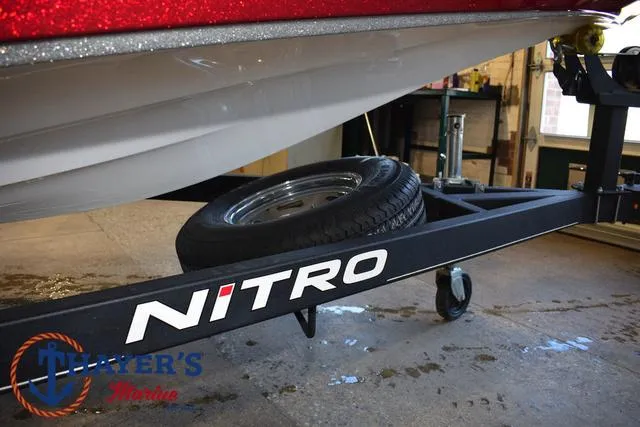 Slide: The Image of 2019 Nitro Z18 boat trailer with spare tire in a garage setting. - 6