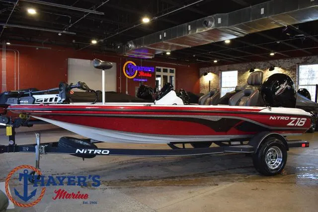 Slide: The Image of 2019 Nitro Z18 boat in showroom, red and black design, Mayer's Marine logo visible. - 7