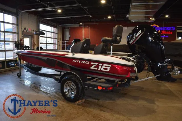 Slide: The Image of 2019 Nitro Z18 boat with Mercury engine displayed indoors at Thayer's Marine. - 8