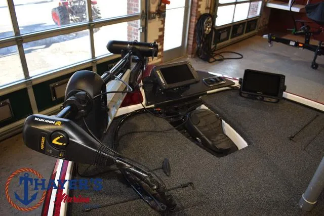 Slide: The Image of 2019 Nitro Z18 boat interior with fishing equipment and electronics in a garage setting. - 9