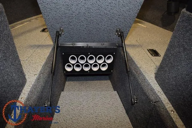 Slide: The Image of 2024 Lund 1775 Impact XS Sport interior storage compartment with rod holders. - 16