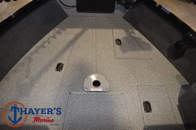 Slide: The Image of 2024 Lund 1775 Impact XS Sport boat interior with storage compartments, Thayer's Marine logo. - 17