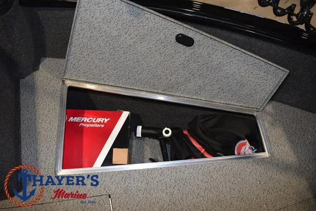Slide: The Image of 2024 Lund 1775 Impact XS Sport storage compartment with Mercury propellers box. - 18