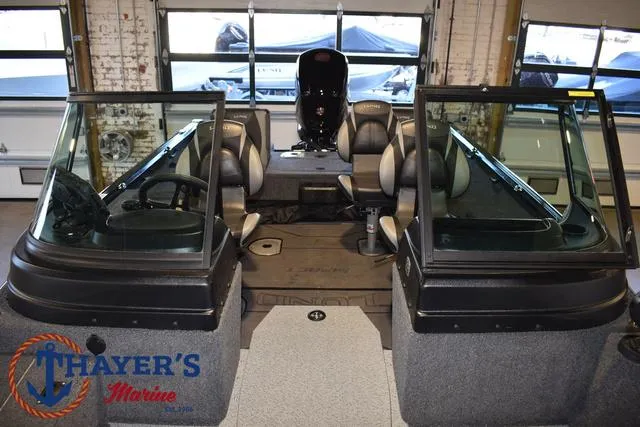Slide: The Image of 2024 Lund 1775 Impact XS Sport boat interior at Thayer's Marine showroom. - 22