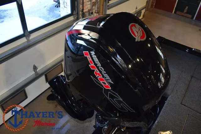 Slide: The Image of 2024 Lund 1775 Impact XS Sport with Mercury Pro outboard motor in garage. - 32