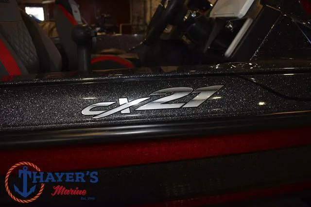 Slide: The Image of 2022 Caymas CX 21 boat interior with logo, showcased at Thayer's Marine. - 10