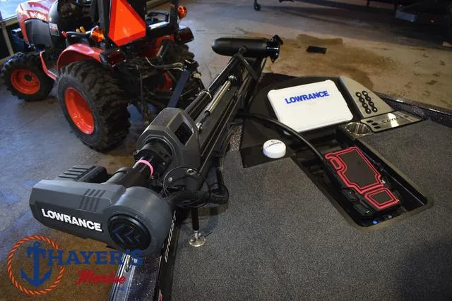 Slide: The Image of 2022 Caymas CX 21 boat with Lowrance equipment and Thayer's Marine logo. - 12