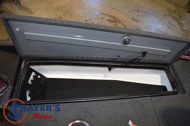 Slide: The Image of 2022 Caymas CX 21 boat storage compartment with open lid, showcasing interior space. - 16
