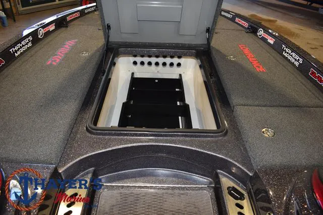 Slide: The Image of 2022 Caymas CX 21 boat interior with storage compartment open, featuring Thayer's Marine branding. - 18