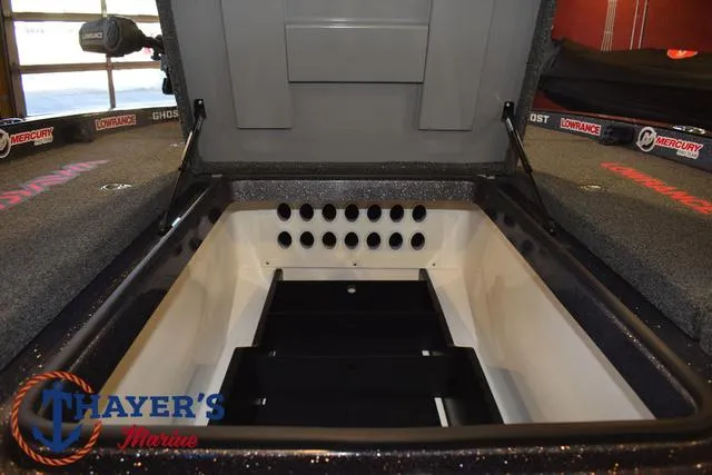 Slide: The Image of Open storage compartment in 2022 Caymas CX 21 boat at Thayer's Marine. - 19