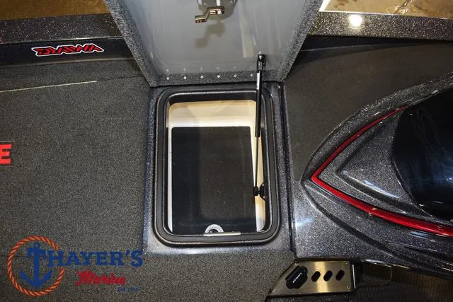 Slide: The Image of 2022 Caymas CX 21 boat storage compartment with open hatch and visible interior. - 20