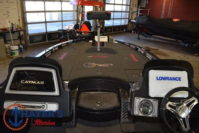 Slide: The Image of 2022 Caymas CX 21 boat interior with Lowrance electronics at Thayer's Marine. - 23