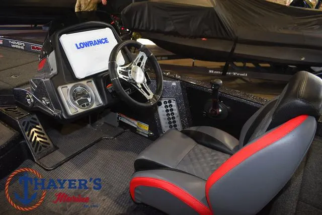 Slide: The Image of 2022 Caymas CX 21 boat cockpit with steering wheel and Lowrance display. - 30