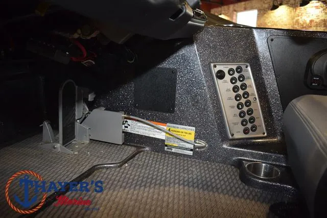 Slide: The Image of Interior view of 2022 Caymas CX 21 boat dashboard with control panel. - 31