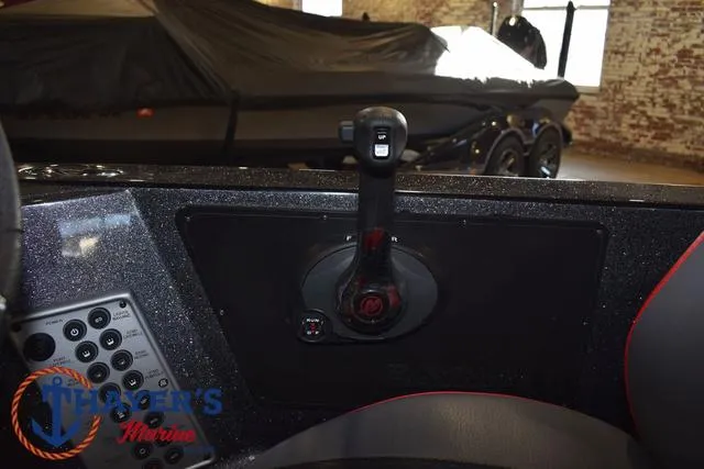 Slide: The Image of 2022 Caymas CX 21 boat control panel with throttle lever in showroom. - 32