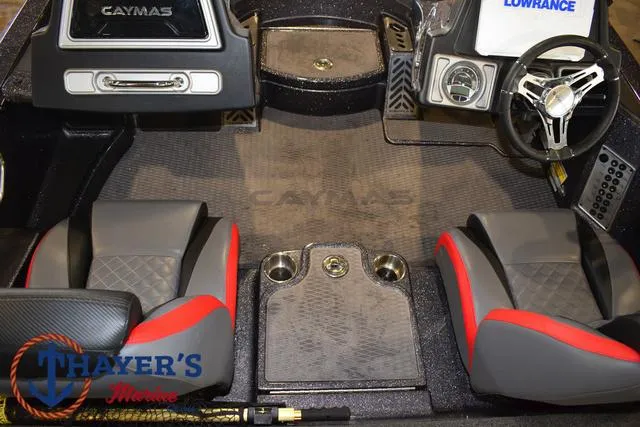 Slide: The Image of 2022 Caymas CX 21 boat interior with steering wheel and seating. - 35