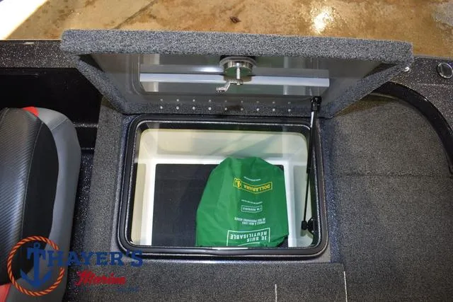 Slide: The Image of 2022 Caymas CX 21 boat storage compartment with green bag inside. - 37