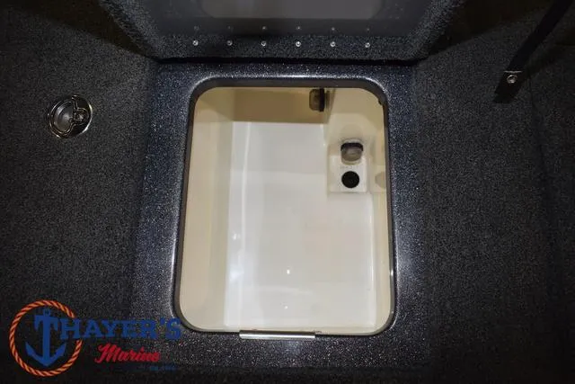 Slide: The Image of 2022 Caymas CX 21 boat storage compartment with Thayer's Marine logo. - 40