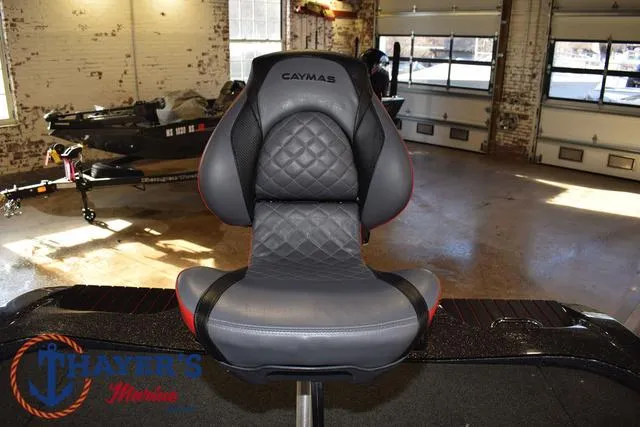 Slide: The Image of Caymas CX 21 boat seat, 2022 model, in a garage setting. - 41