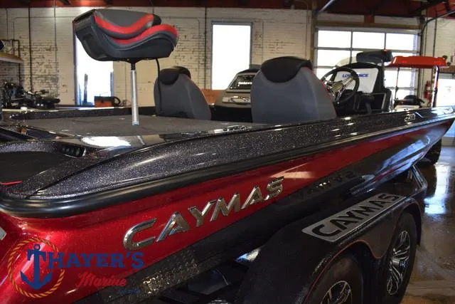 Slide: The Image of 2022 Caymas CX 21 boat in showroom, featuring sleek design and comfortable seating. - 46