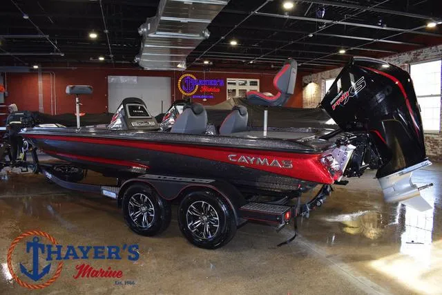 Slide: The Image of 2022 Caymas CX 21 boat in showroom, featuring sleek design and powerful engine. - 5