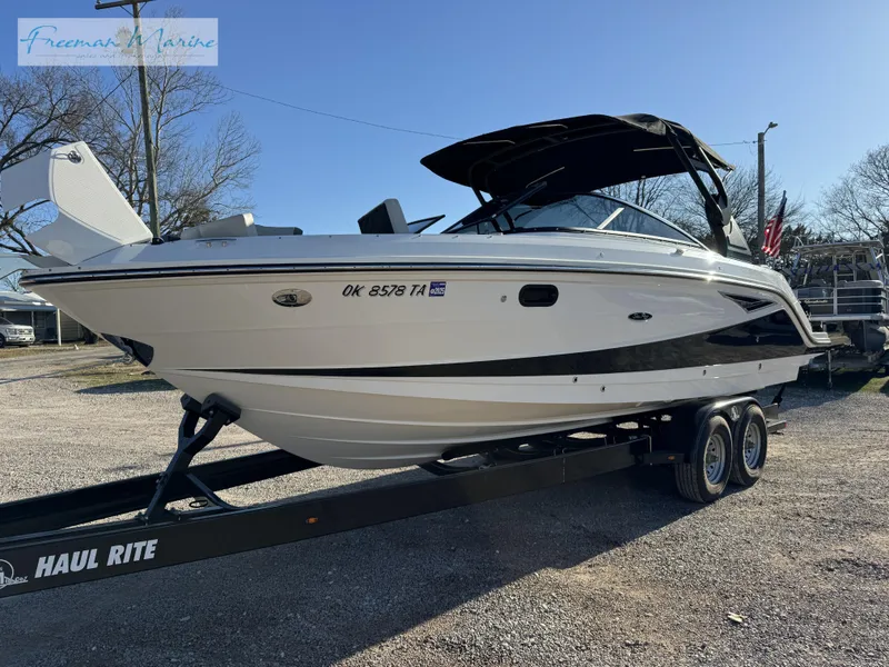 The Image of 2020 Sea Ray SLX 280 boat on trailer, outdoor setting, clear sky. - 0