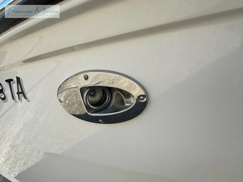 Slide: The Image of 2020 Sea Ray SLX 280 boat detail, featuring a close-up of a hull fitting. - 10