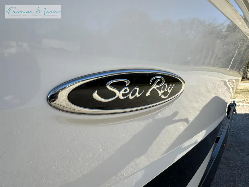 Slide: The Image of 2020 Sea Ray SLX 280 boat emblem on sleek white hull. - 11