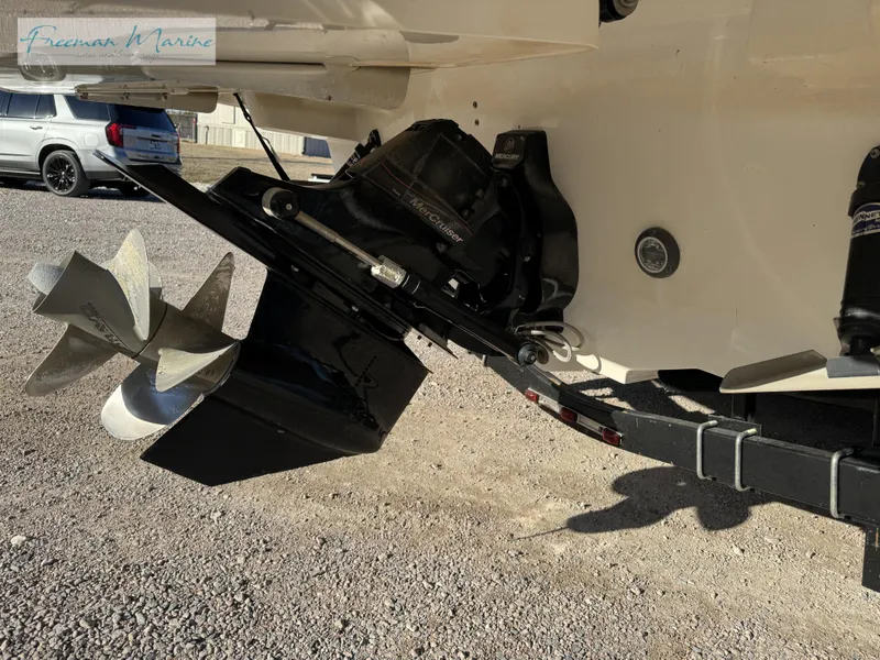 Slide: The Image of 2020 Sea Ray SLX 280 boat propeller and stern drive on a trailer. - 13