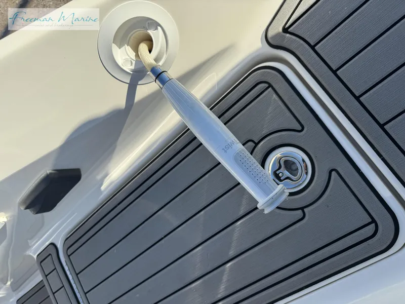 Slide: The Image of 2020 Sea Ray SLX 280 deck with hose connection and textured flooring. - 14